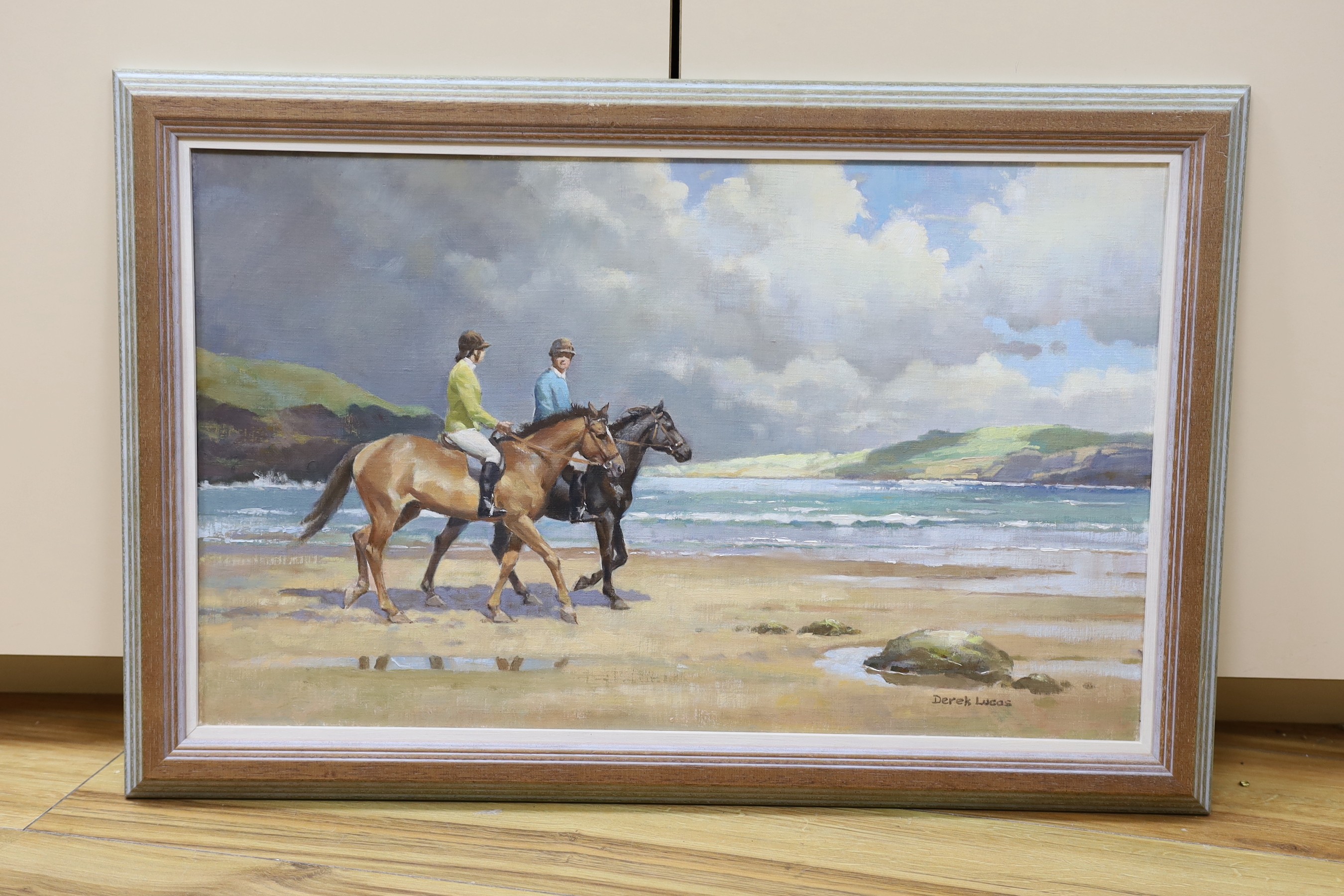 Derek Lucas, oil on board, Horse riders on the seashore, signed, 36 x 60cm